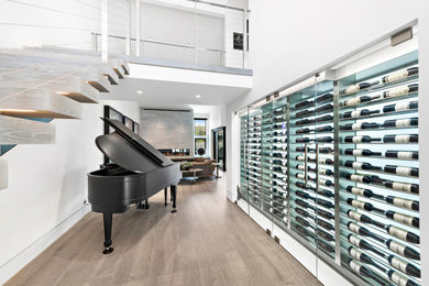 Example of a minimalist wine cellar design in Los Angeles