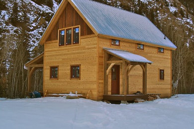 Inspiration for a mid-sized craftsman brown two-story wood gable roof remodel in Denver