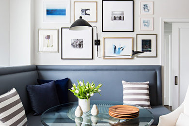 Dining room - contemporary dark wood floor and brown floor dining room idea in New York with white walls