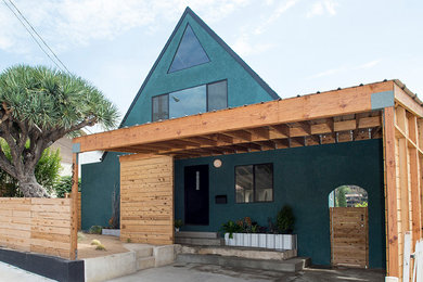 Photo of a mid-sized modern three-storey green exterior in Los Angeles.