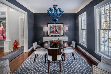 Inspiration for a timeless dark wood floor enclosed dining room remodel in Columbus with blue walls and no fireplace