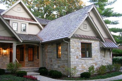 Large transitional beige one-story mixed siding exterior home idea in Chicago with a shingle roof
