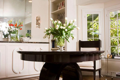 Mid-sized trendy medium tone wood floor and brown floor enclosed dining room photo in Los Angeles with white walls and no fireplace