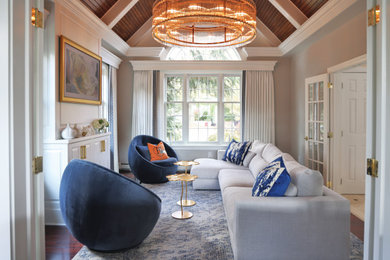 Example of a mid-sized transitional medium tone wood floor and wall paneling living room design in Philadelphia with beige walls