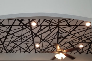 Family room - mid-sized modern loft-style tray ceiling and wallpaper family room idea in Dallas with no tv