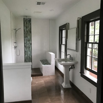 Painted white bathroom with brown window frames