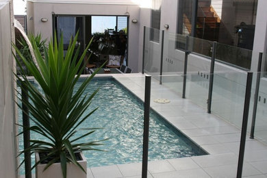Inspiration for a mid-sized modern courtyard rectangular pool in Newcastle - Maitland.