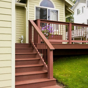 Charming Front Porch with Matching Flower Boxes and Multi-Level Walkway
