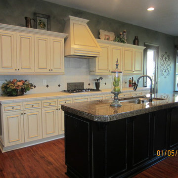Faux glazed cabinets with Black distressed island
