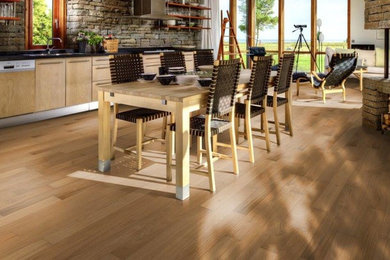 Kitchen/dining room combo - small contemporary light wood floor and brown floor kitchen/dining room combo idea in Chicago with white walls and no fireplace