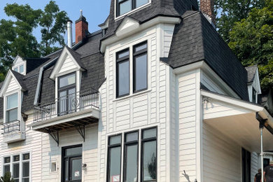 Ornate vinyl exterior home photo in Montreal