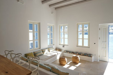 This is an example of a beach style living room in Milan.