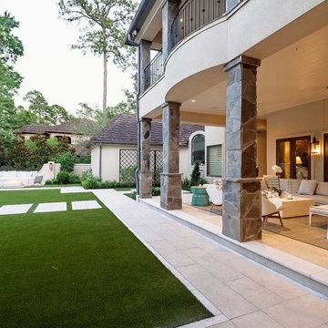 Rectangular pool, covered patio and kitchen, outdoor shower, landscaping