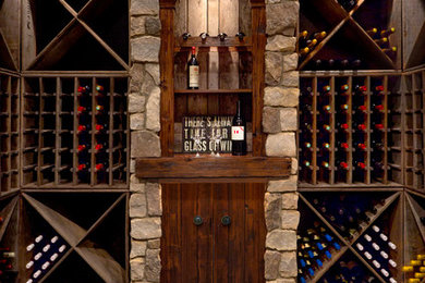 Design ideas for a large transitional wine cellar in Detroit with brick floors, storage racks and grey floor.