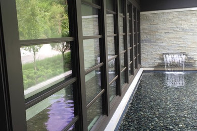 Inspiration for a mid-sized modern gray one-story vinyl exterior home remodel in Phoenix with a shed roof