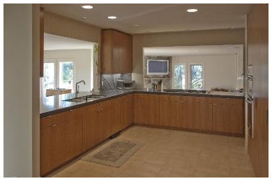 Expansive contemporary kitchen in Orange County with a triple-bowl sink, flat-panel cabinets, medium wood cabinets, quartz worktops, grey splashback, stone tiled splashback and limestone flooring.