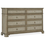 Hooker Furniture - Alfresco Aldo 8-Drawer Dresser - With understated style and exquisite design details, the eight-drawer Costiere Chest exudes character. Crafted of Oak Veneers with cedar-lined bottom drawers, the Aldo Dresser is finished in the soft taupe Sorrento, blended with a gray two-tone paint. The delightful fleur-de-lis-shaped hardware is hand hammered with a vintage glam Florentine gold color.