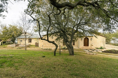 Example of a tuscan exterior home design in Austin