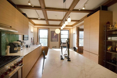 Eat-in kitchen - large 1950s u-shaped medium tone wood floor eat-in kitchen idea in New York with an island, an undermount sink, light wood cabinets, marble countertops, green backsplash, glass tile backsplash and stainless steel appliances