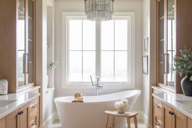 Bathroom - large transitional master porcelain tile, white floor, double-sink and exposed beam bathroom idea in Kansas City with shaker cabinets, light wood cabinets, a one-piece toilet, an undermount sink, quartz countertops, white countertops and a built-in vanity