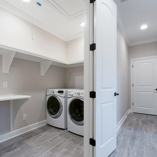 Design ideas for a medium sized traditional laundry cupboard in Nashville with grey walls, ceramic flooring, a side by side washer and dryer, multi-coloured floors and turquoise worktops.