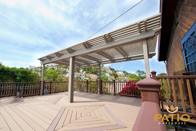 Photo of a traditional backyard patio in Orange County with decking and a pergola.