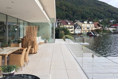Photo of a contemporary deck in Munich with with dock.