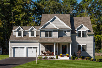 Mid-sized elegant gray two-story wood exterior home photo in Boston with a shed roof