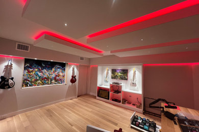 Inspiration for a large timeless freestanding desk brown floor and coffered ceiling home studio remodel in Detroit with gray walls