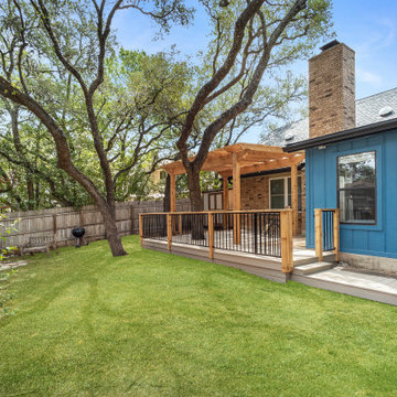 Composite deck, cedar pergola, metal railing with cedar posts