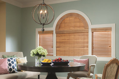 Enclosed dining room - mid-sized traditional dark wood floor enclosed dining room idea in Sacramento with green walls