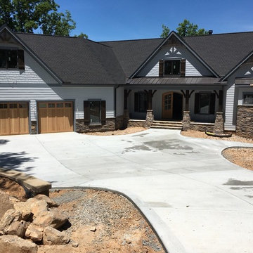 The garage doors and driveway have been installed.
