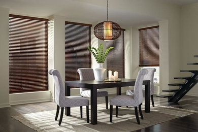 Example of a mid-sized transitional dark wood floor and brown floor enclosed dining room design in San Francisco with beige walls and no fireplace