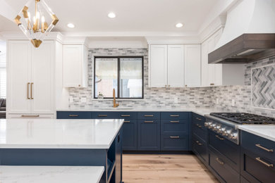 Inspiration for a mid-sized country eat-in kitchen in Salt Lake City with an undermount sink, shaker cabinets, blue cabinets, quartz benchtops, grey splashback, panelled appliances, light hardwood floors, with island and white benchtop.