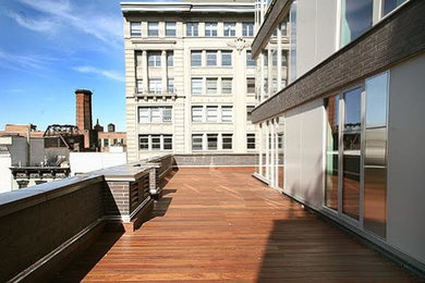 Mid-sized trendy side yard deck photo in New York