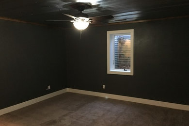 Bedroom - rustic bedroom idea in Other