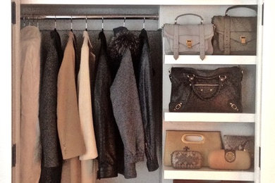 Reach-in closet - mid-sized contemporary gender-neutral medium tone wood floor reach-in closet idea in New York