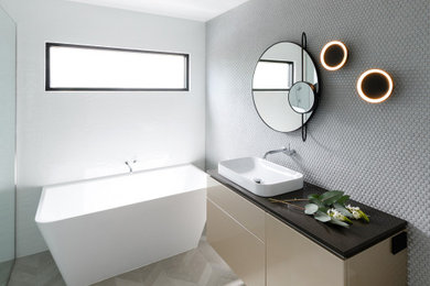Design ideas for a contemporary bathroom in Hobart with mosaic tile, green walls, ceramic floors and a niche.