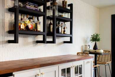 Dry bar - mid-sized contemporary single-wall dry bar idea in Philadelphia with no sink, white cabinets and wood countertops