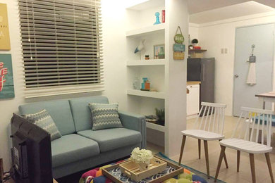 Example of a small beach style formal and enclosed porcelain tile and beige floor living room design in Other with white walls and a tv stand