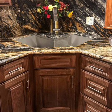 Corner sinks and corner sink kitchens