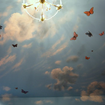 Sky Ceiling Mural with Butterflies, hand-painted in a bedroom by Mural Art LLC.