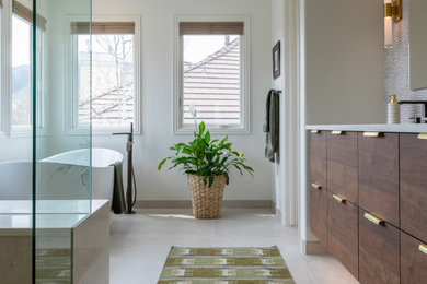 Bathroom - mid-sized transitional master beige tile and porcelain tile porcelain tile, beige floor and double-sink bathroom idea in Denver with dark wood cabinets, a two-piece toilet, white walls, an undermount sink, quartz countertops, a hinged shower door, white countertops and a floating vanity