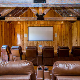 Home theater - huge rustic home theater idea in New Orleans
