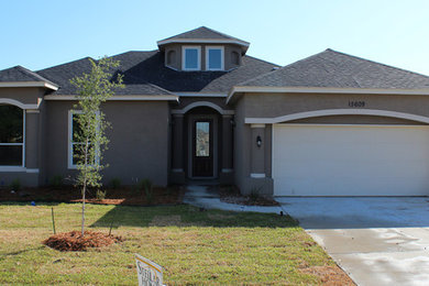 Example of a large gray two-story exterior home design in Austin