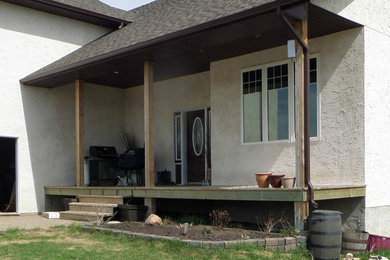 Deck - farmhouse deck idea in Calgary