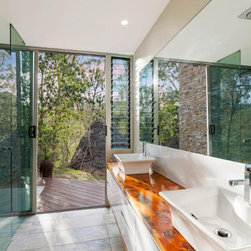 Tall narrow Breezway louvres in the bathroom keep mirrors steam-free - Windows