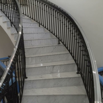 Bespoke Carrara Marble staircase with black rails.