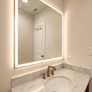 Vanity Sink with Veined Stone Countertop