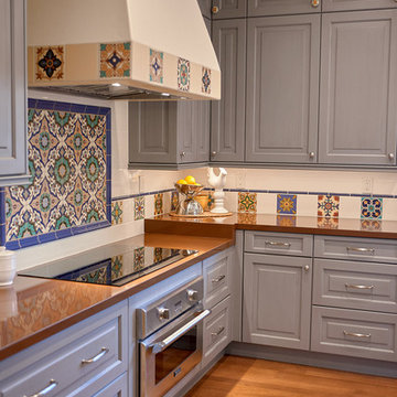 close up of custom tile work and hood